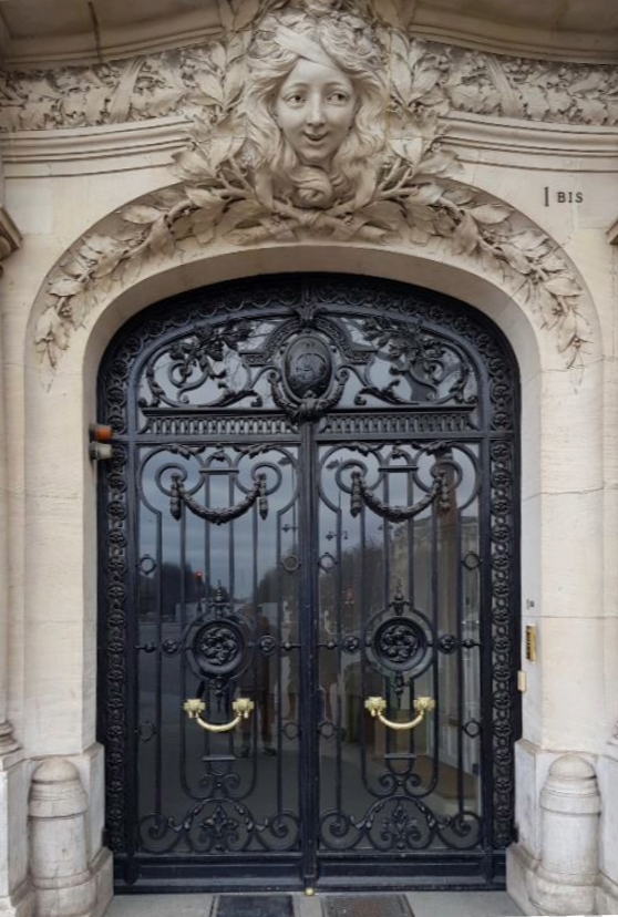 Custom medieval wrought iron door featuring intricate detailing and a regal, timeless design, perfect for enhancing a historic or classic home.